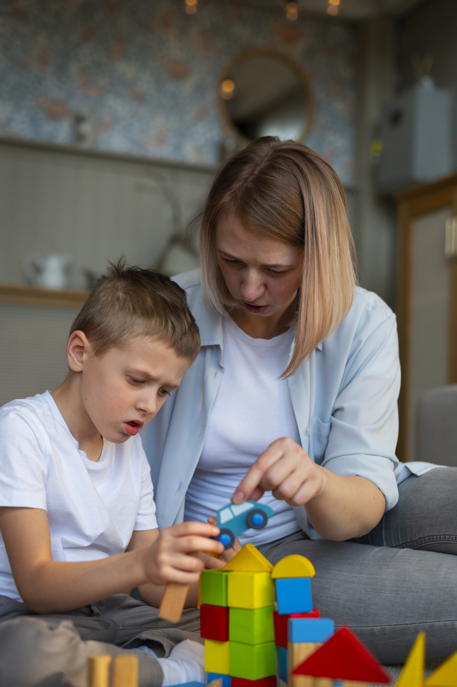 Mother supporting her child through toy-based learning